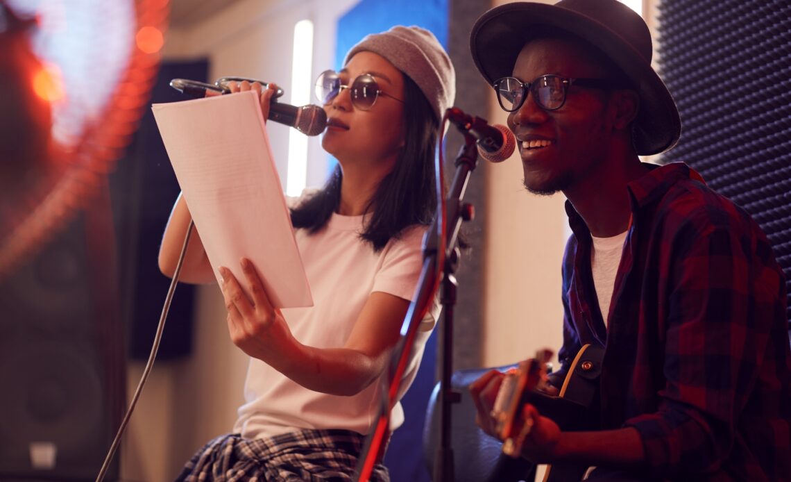 Musical Duo Singing in Studio