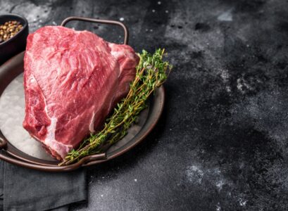 Raw Wild Boar meat, fresh Game Meat. black background. top view